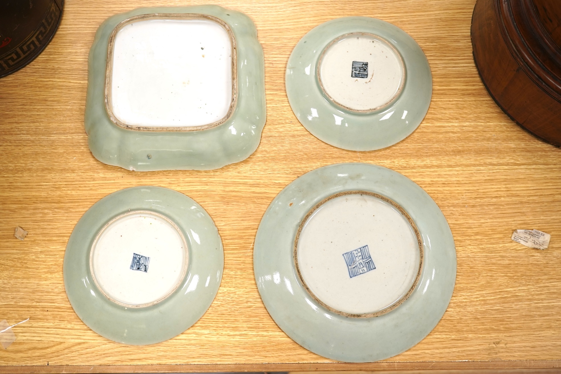 Four 19th century Chinese famille rose celadon ground dishes, largest 25cm